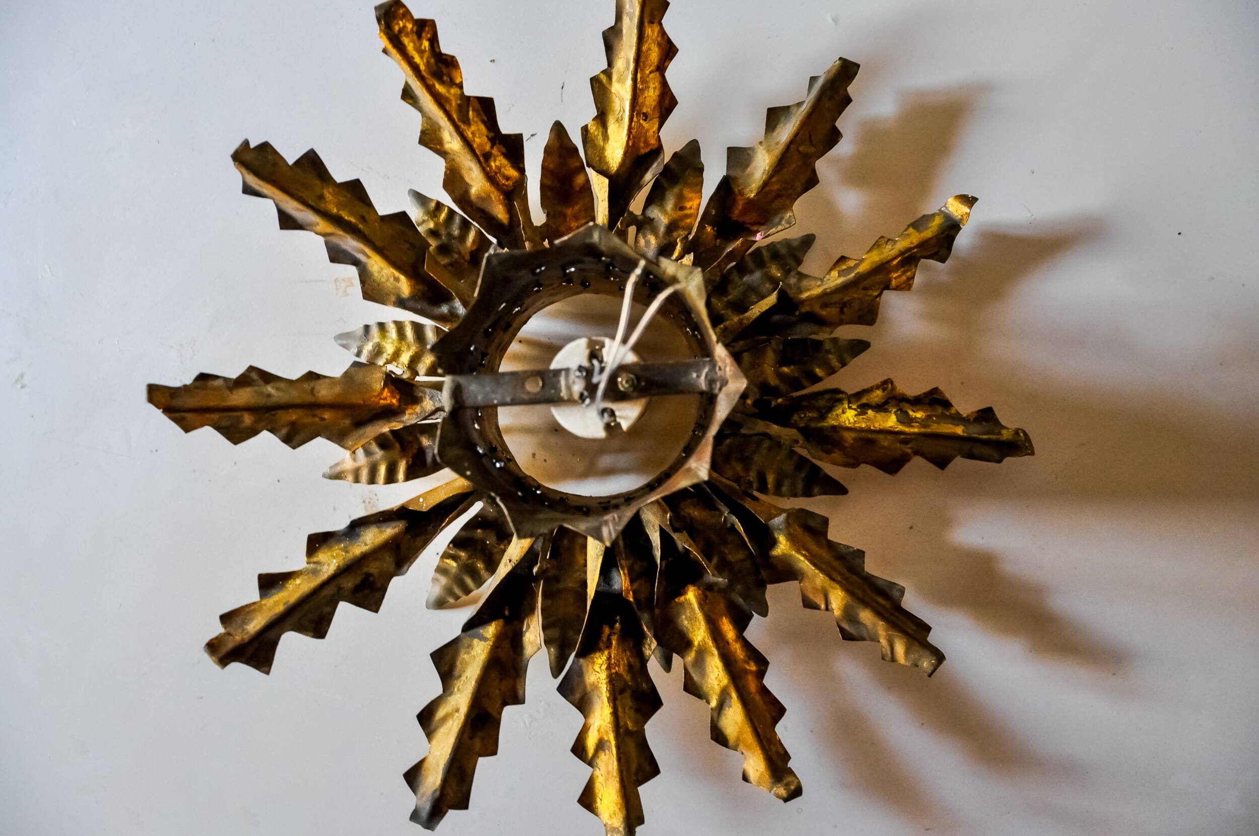 Brutalist sun wall lamp, metal and gold leaf, Italy, 1960