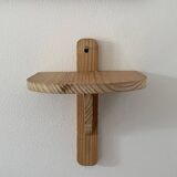 Small wall-mounted wooden shelf