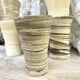 High ceramic cups made of mixed clay.