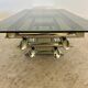 Table basse Space âge années 70 métal tubulaire et verre fumé design italien