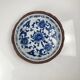 Set of 6 ceramic presentation plates in white and blue, floral pattern with woven wicker frame, 1970s/80s.
