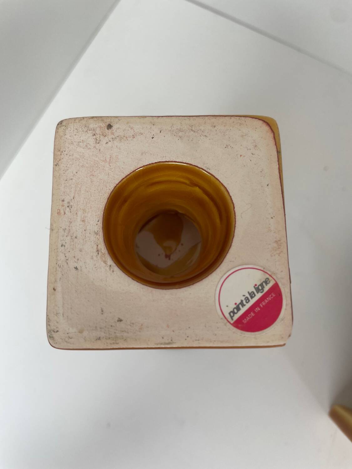 Pair of ocher and green ceramic point-a-line candlesticks