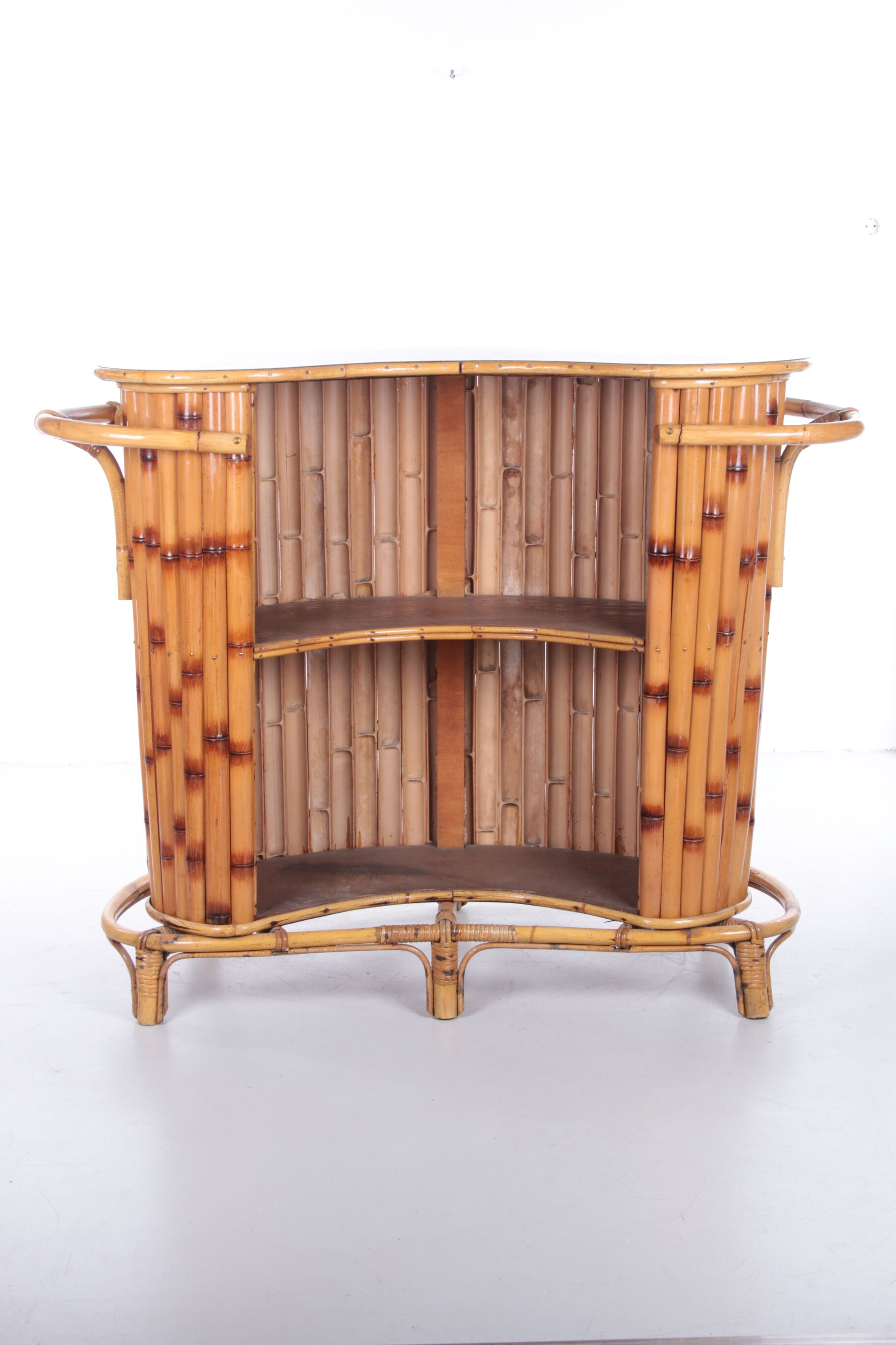 Vintage bamboo Tiki bar cocktail bar with 2 bar stools.