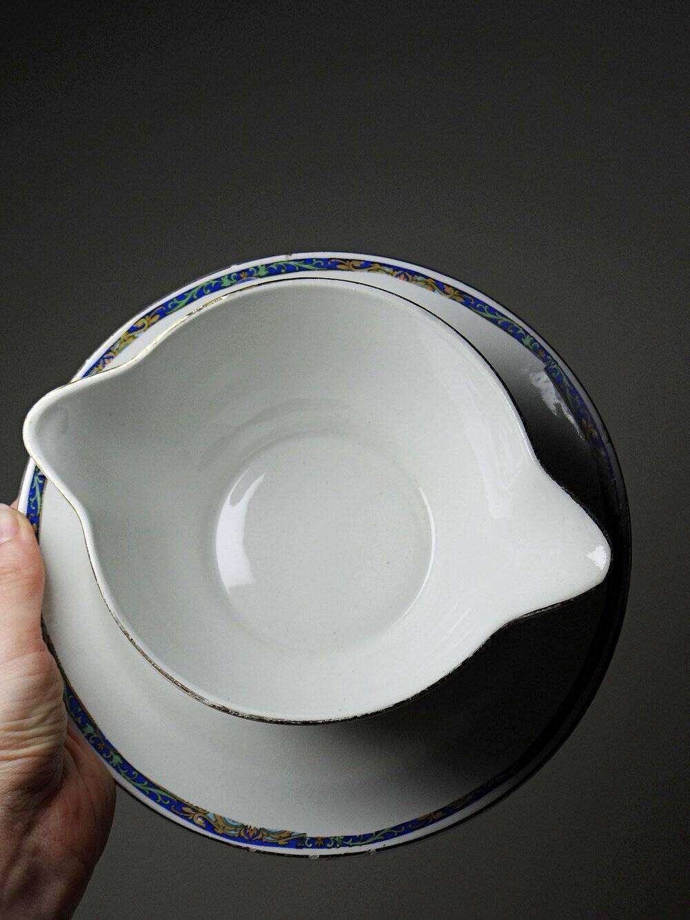 Old Lunéville sauce boat, opaque porcelain with polychrome decoration.