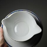 Old Lunéville sauce boat, opaque porcelain with polychrome decoration.