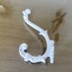 Pair of Art Deco white cast iron coat hooks from the 1930s and 1940s