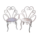 Duo of iron lawn chairs
