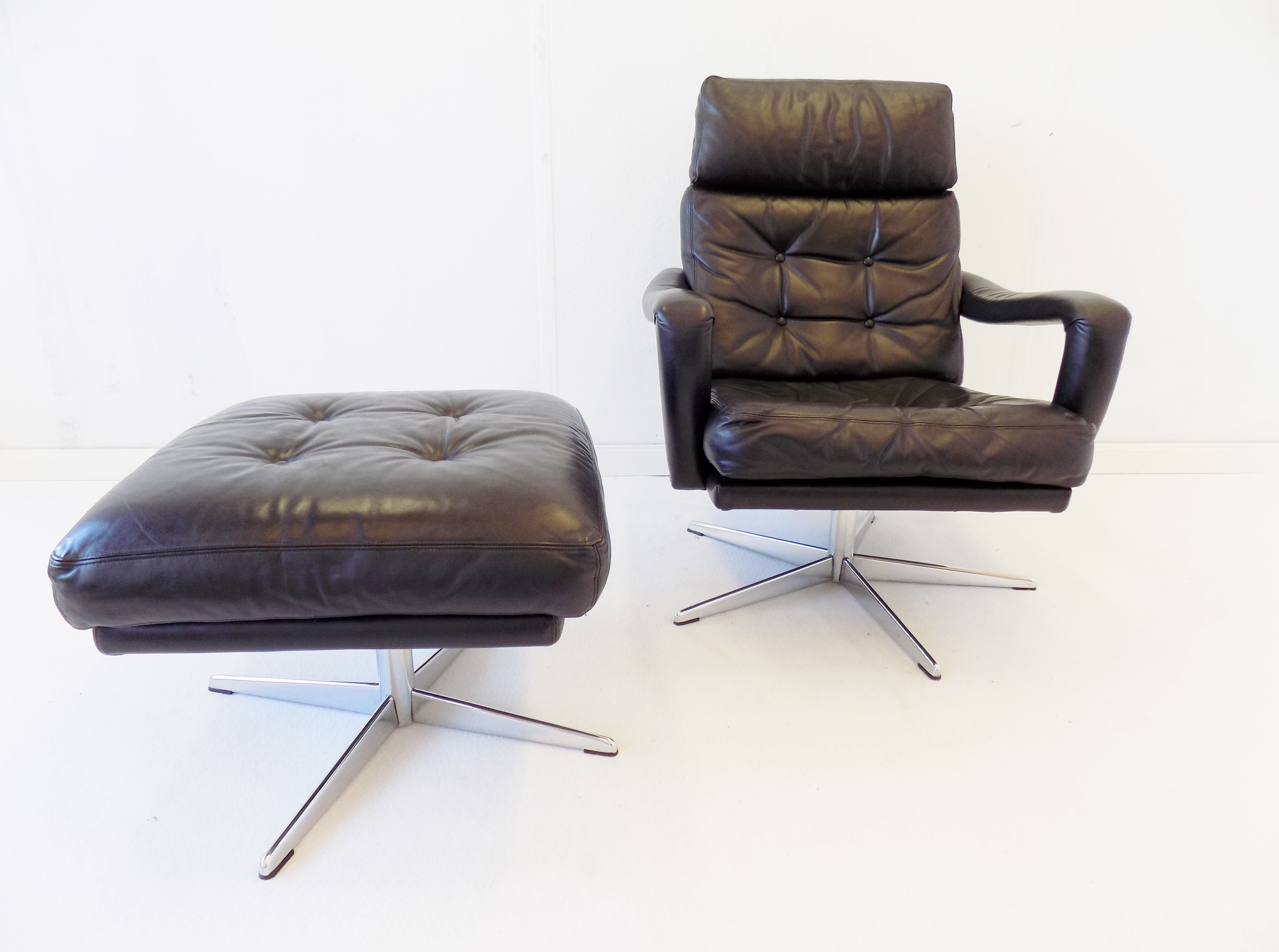 Danish black leather armchair with ottoman 70s