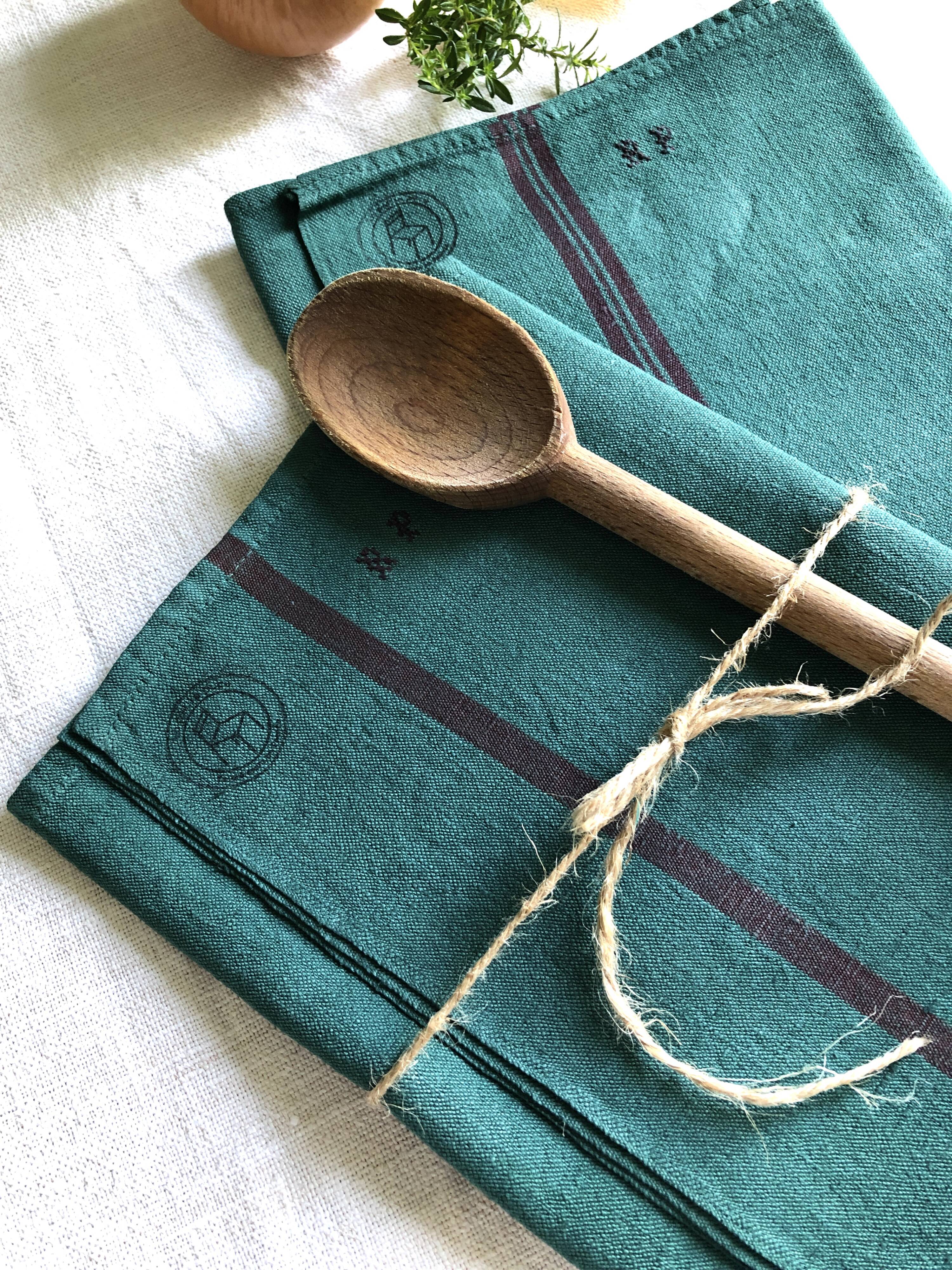 Old linen and cotton tea towel tinted in fir green