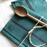 Old linen and cotton tea towel tinted in fir green