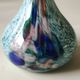 Ball vase soliflore with a long chimney neck. In speckled glass in the Murano style.