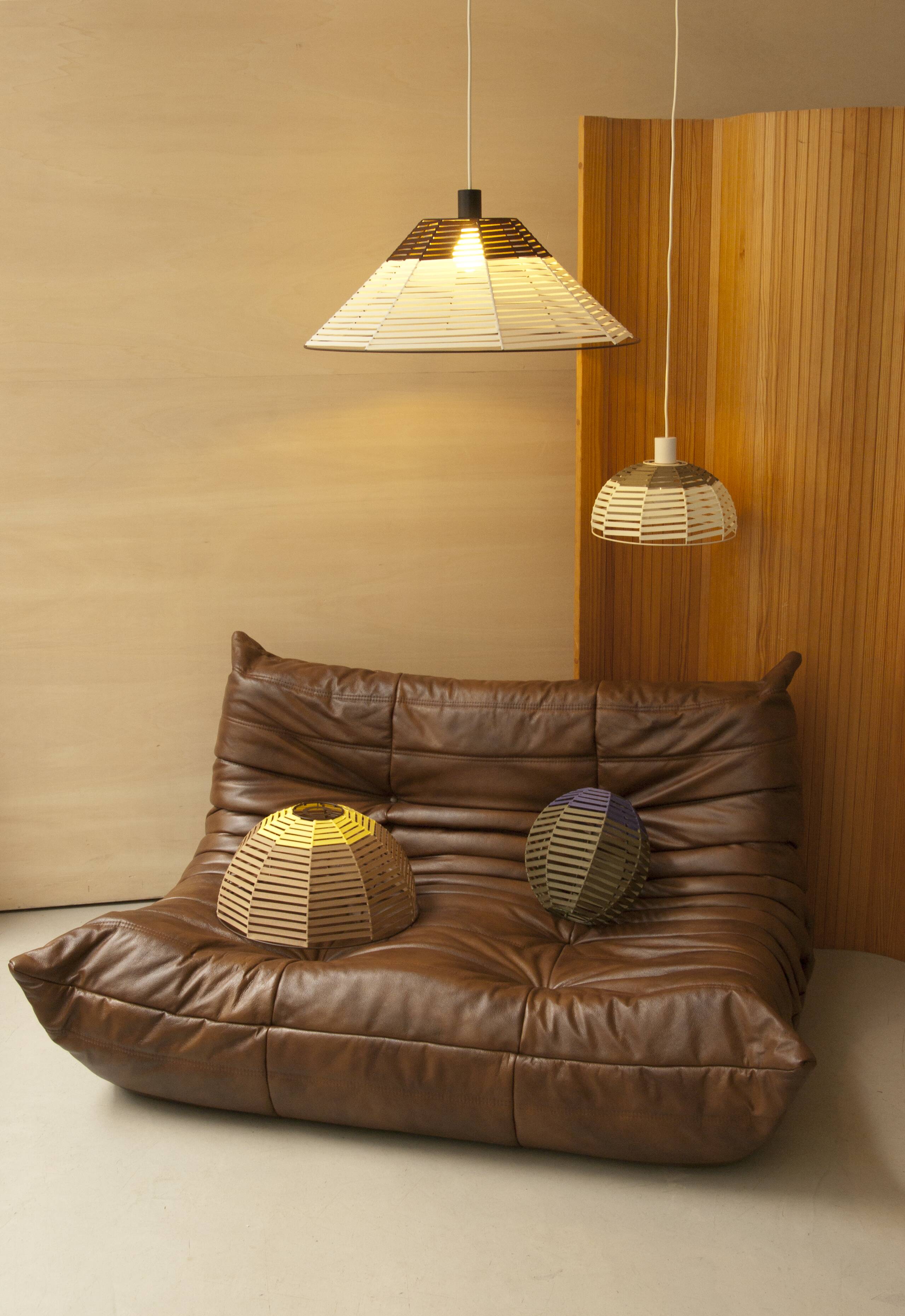 Woven bell suspension on metal structure.