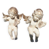 Pair of sitting angel statuettes