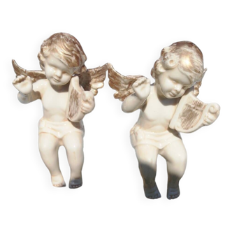 Pair of sitting angel statuettes