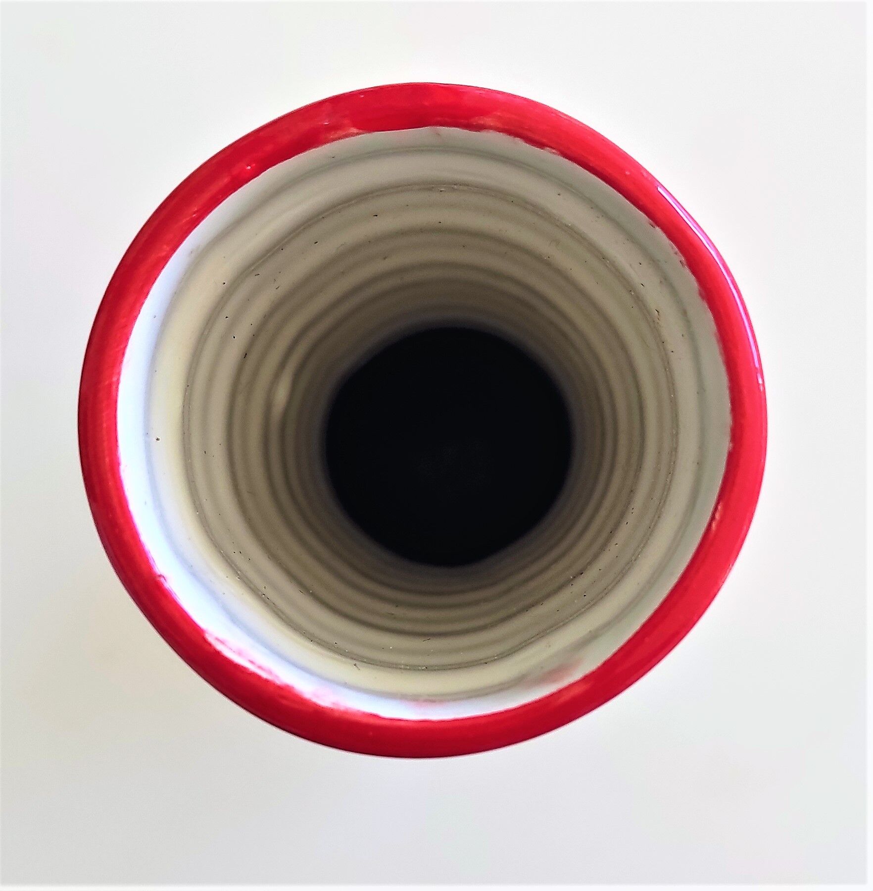Red and white ceramic vase with vintage embossed mark