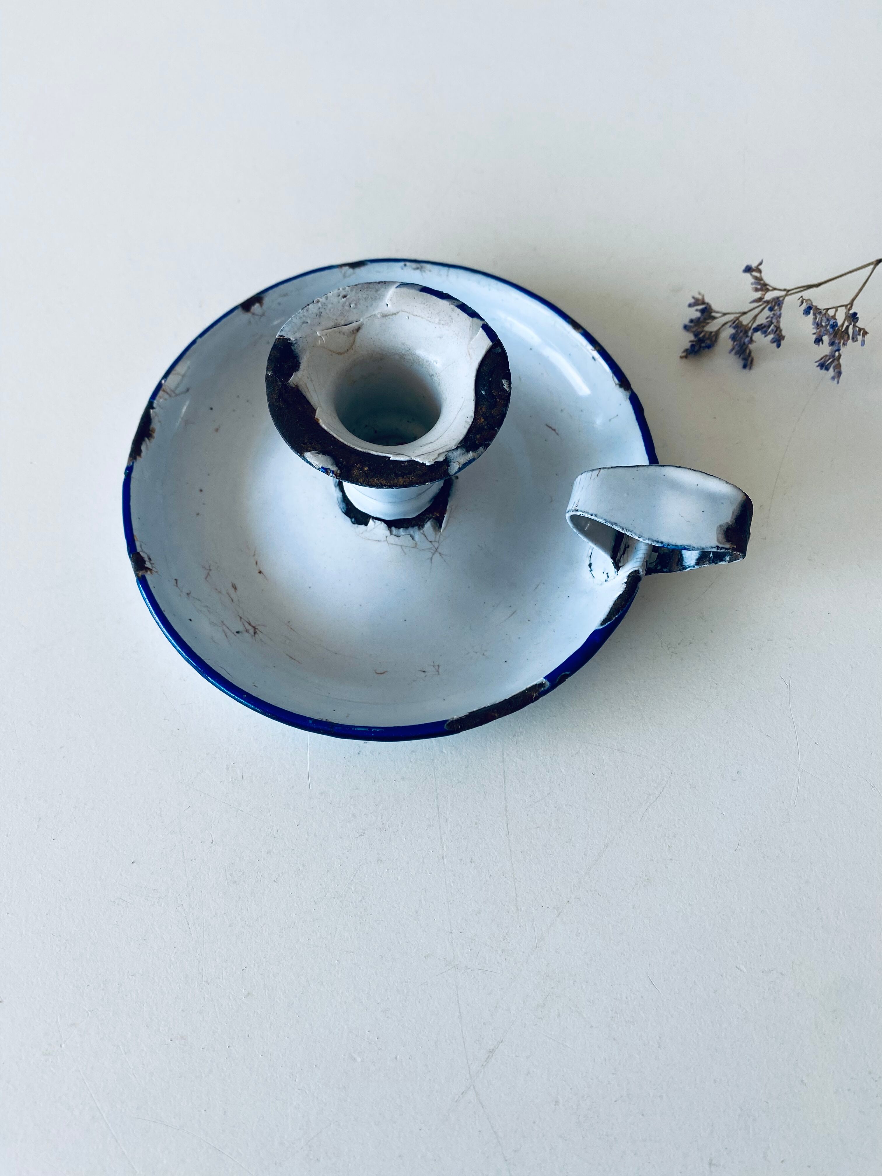 Antique candle holder in white and blue enamelled metal