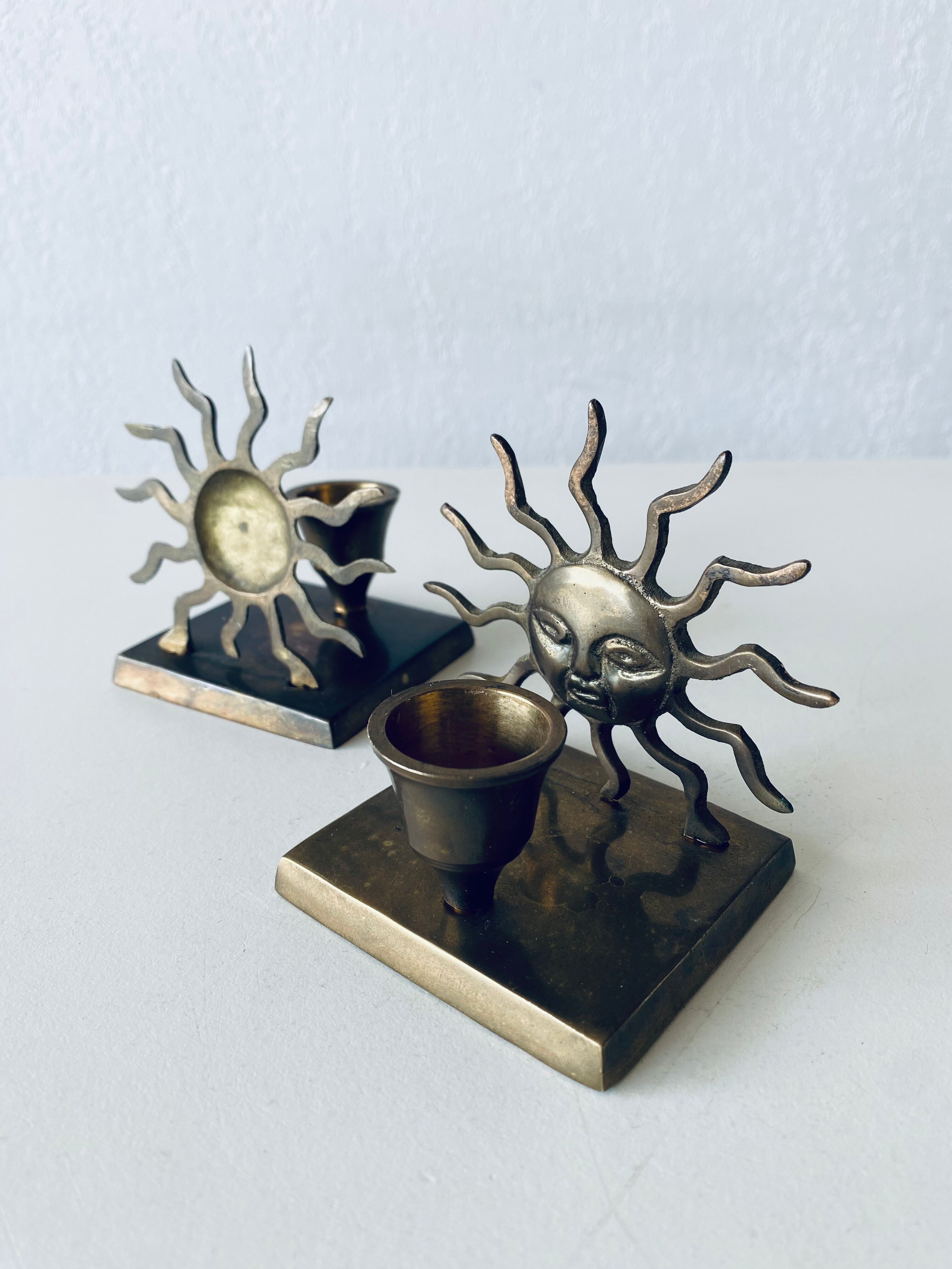 Pair of sun candle holders