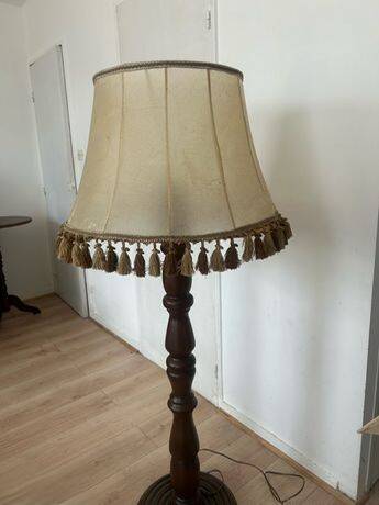 Large vintage wooden floor lamp with parchment shade and pendants.