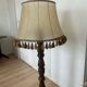 Large vintage wooden floor lamp with parchment shade and pendants.