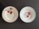 Set of 2 antique deep plates with red flower pattern.