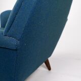 Armchair upholstered with dark blue wool fabric and legs in dark wood, of danish design, 1960s