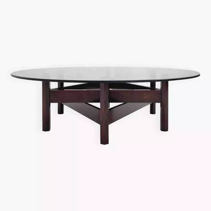 Wooden coffee table with round smoked glass top