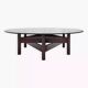 Wooden coffee table with round smoked glass top