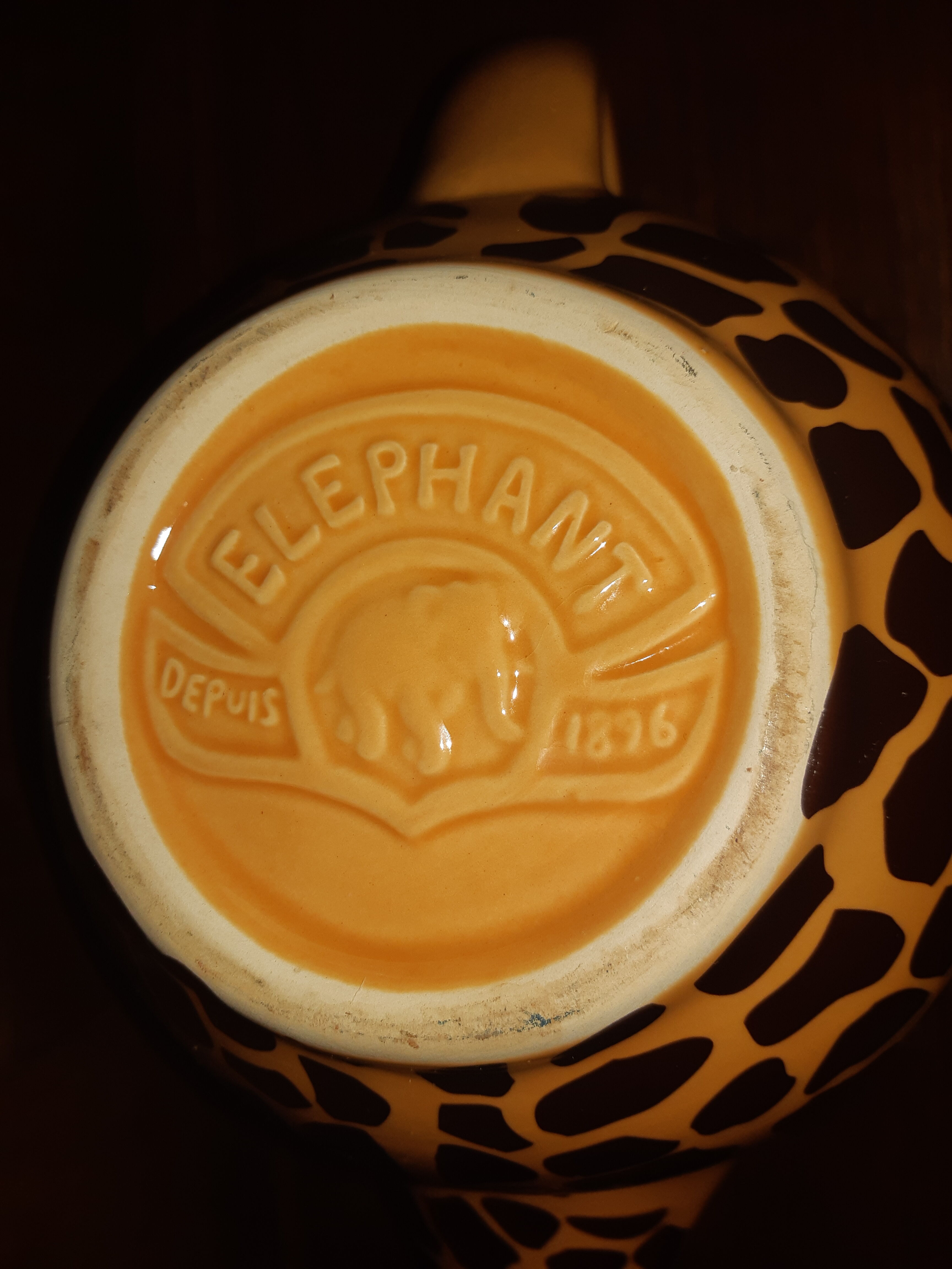 Elephant teapot decorated with giraffe cheetah, signed by the brand elephant 1896