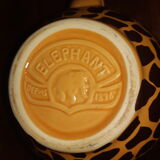 Elephant teapot decorated with giraffe cheetah, signed by the brand elephant 1896