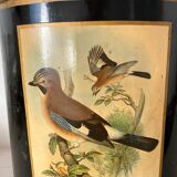 Metal wastebasket with bird decoration