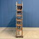 Old wooden workshop shelf with cast iron wheels.
