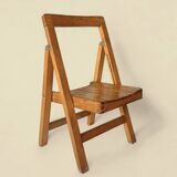 Old varnished wooden folding chair for children
