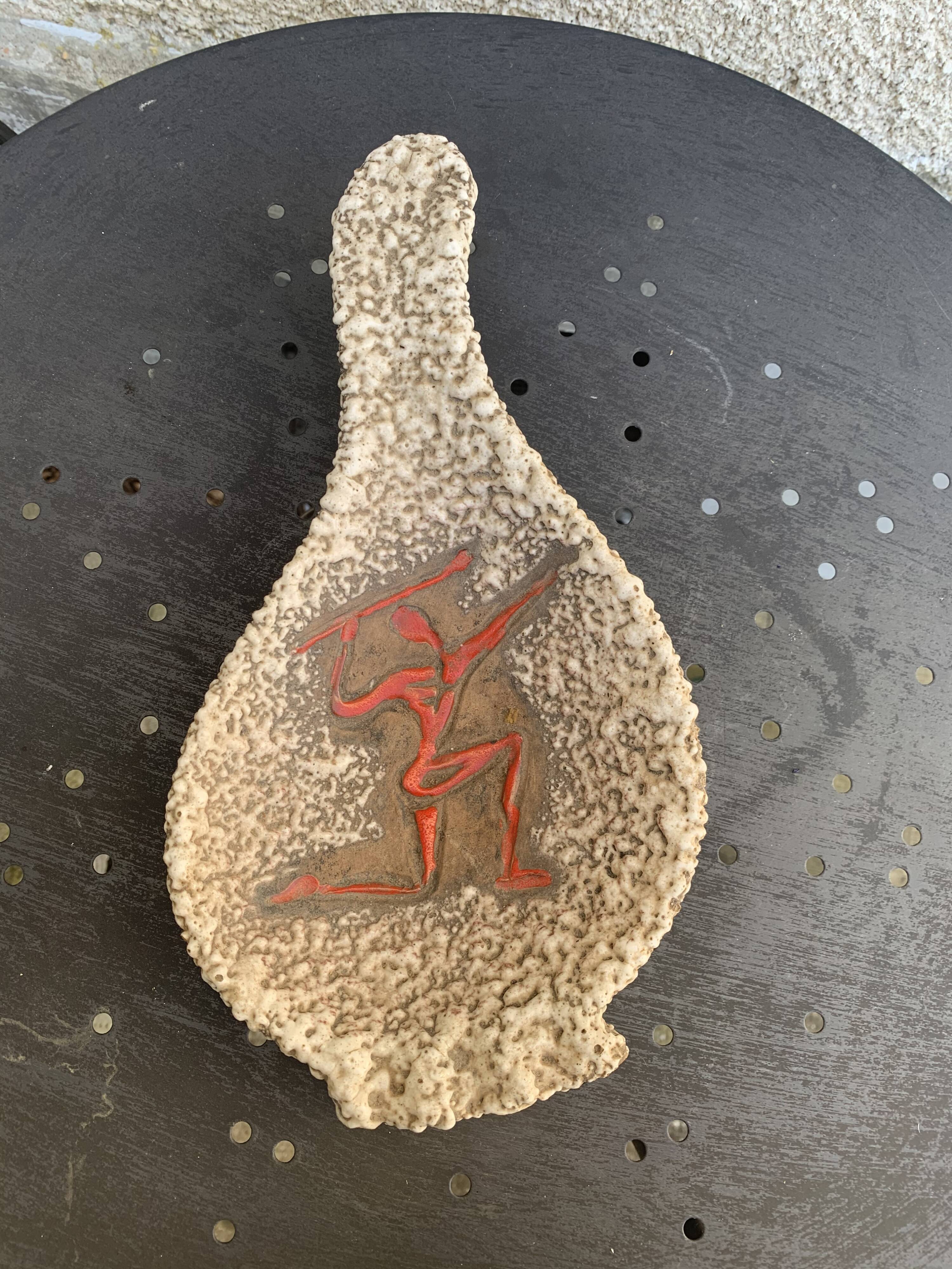 Glassed ceramic cut enamelled prehistoric warrior motif vintage red 1950