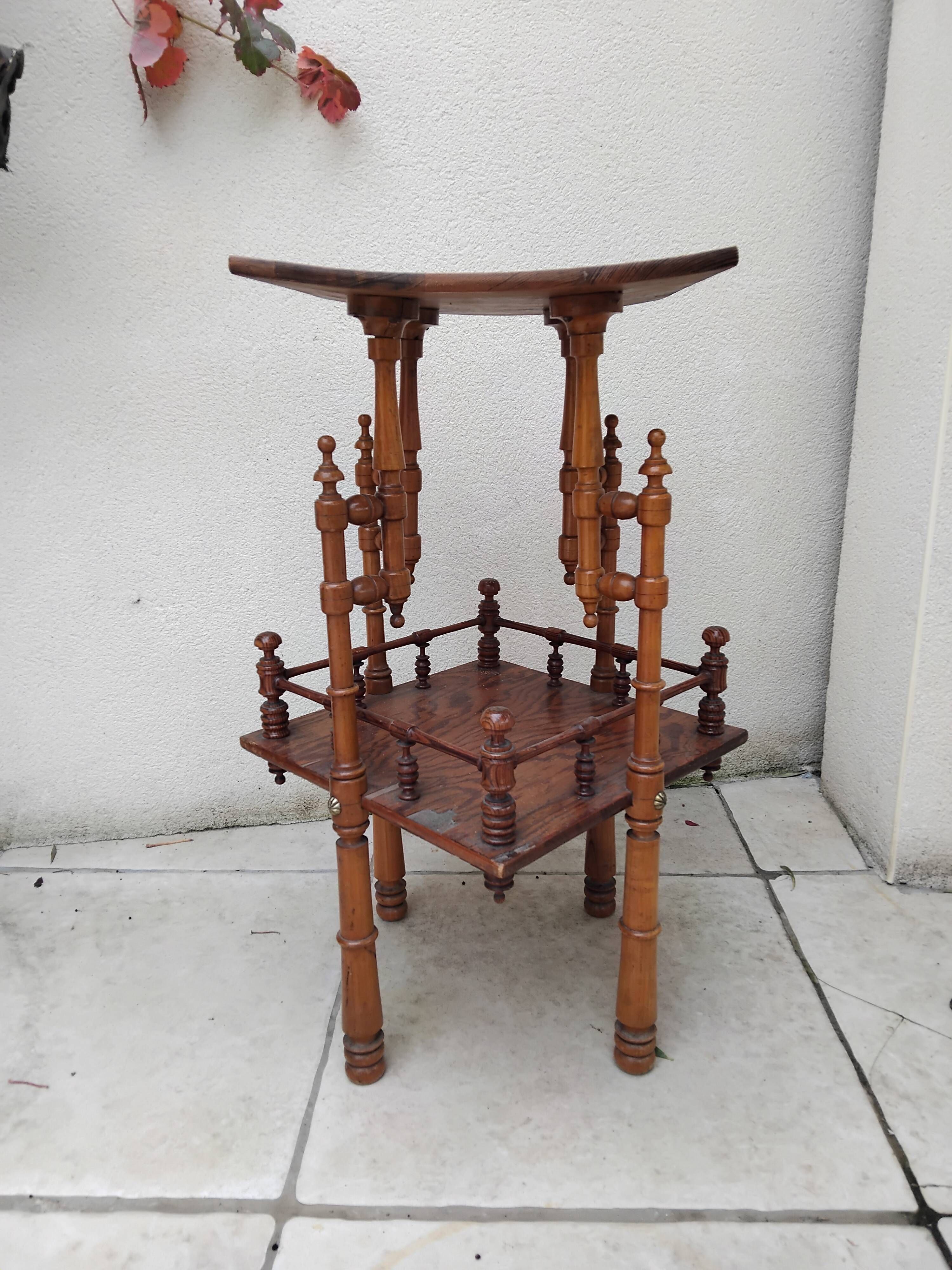 Antique pedestal table in Asian Japonese style.
