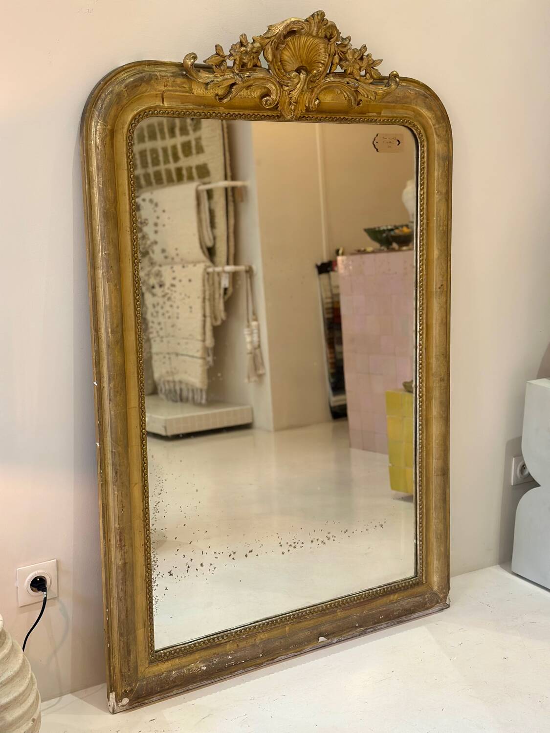 Antique Louis-Philippe mirror carved and gilded with leaf