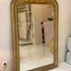Antique Louis-Philippe mirror carved and gilded with leaf