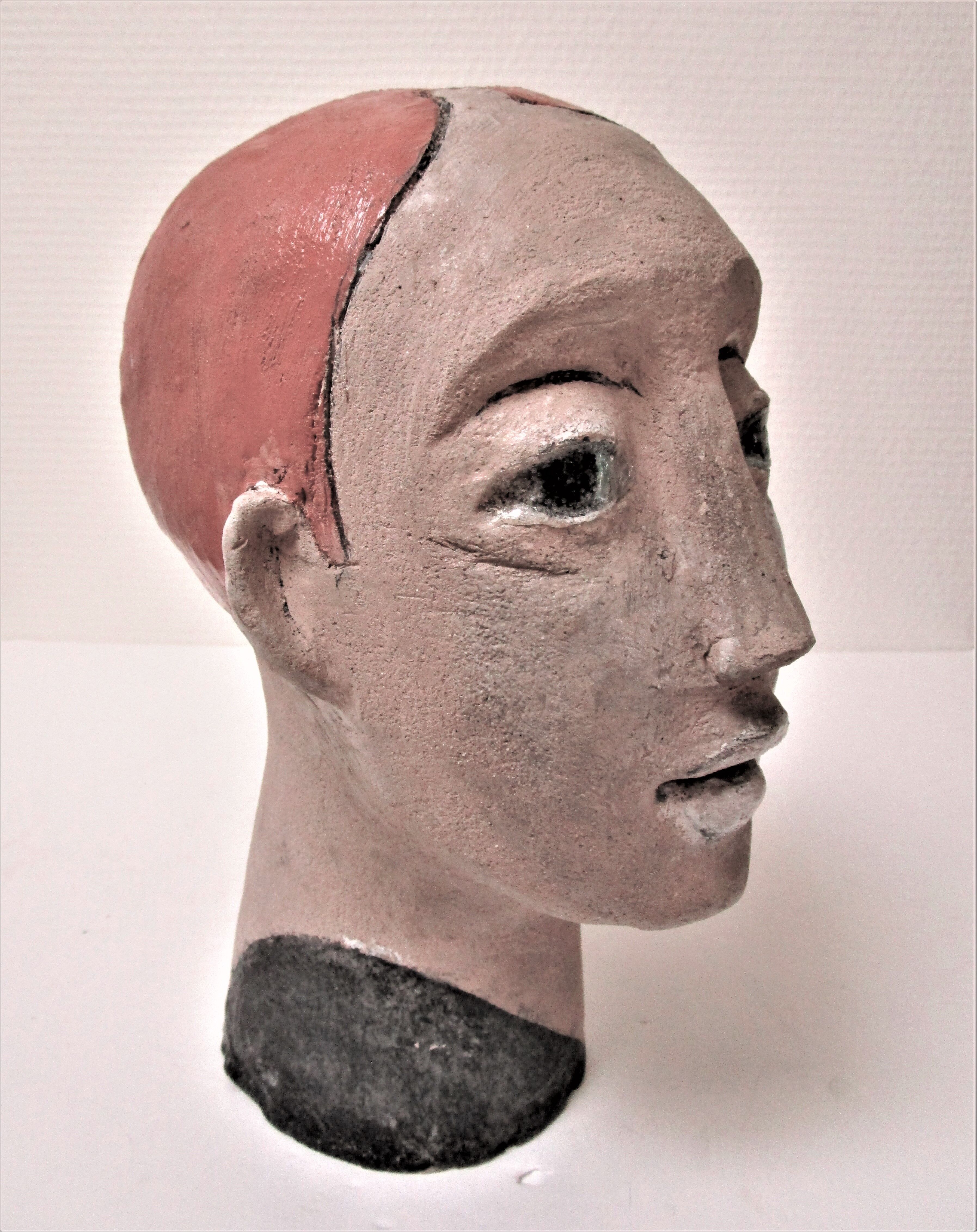 Redheaded boyish woman modeled in earth signed 60/70 years