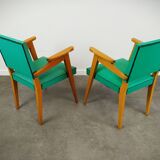 Pair of wood and vinyl armchairs