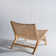 Reclining armchair in natural wood and woven rattan