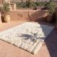 Moroccan handwoven wool rug, 250x150 cm, traditional style.