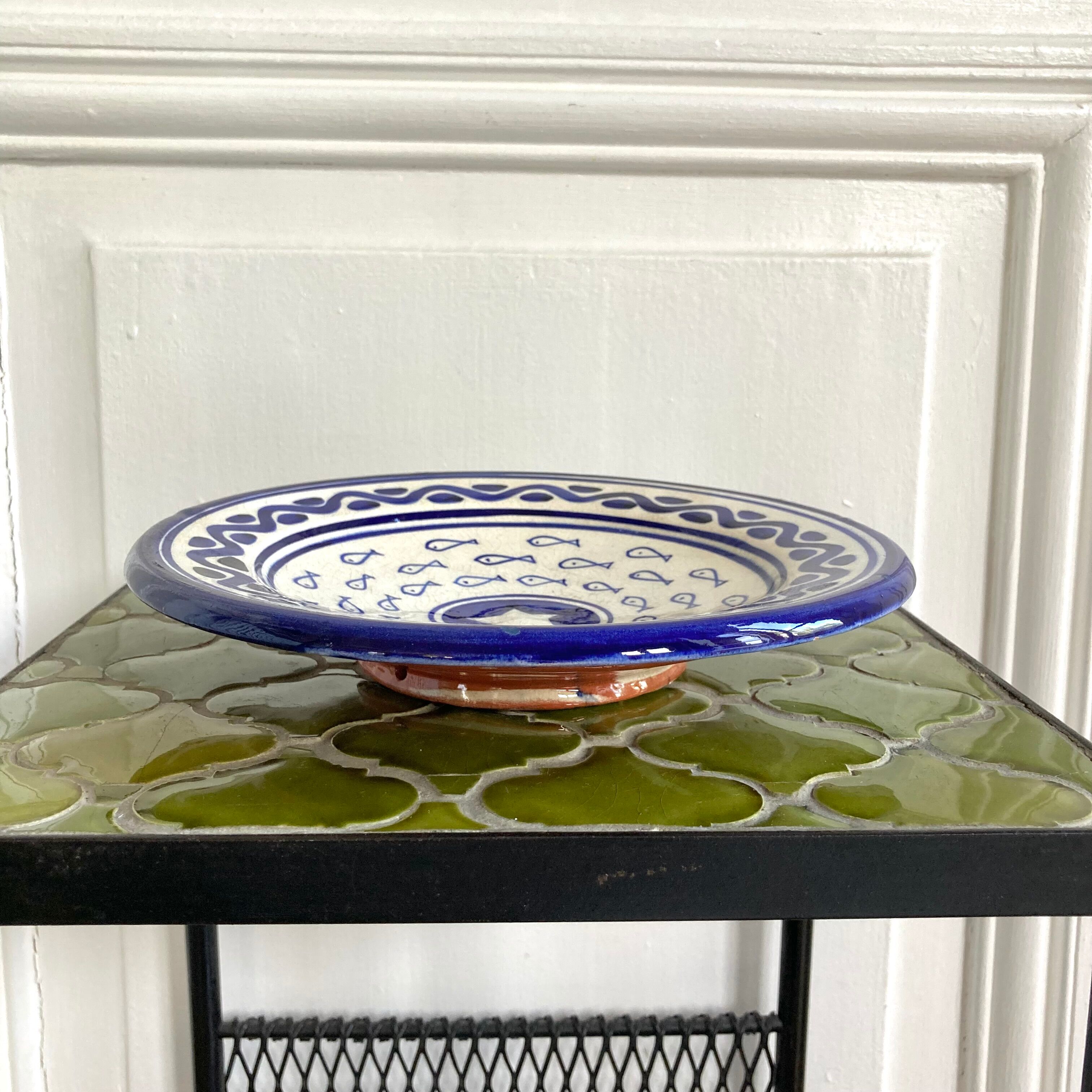 Decorative ceramic deep plate with fish decoration