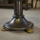 Neo-classical cast iron and glass eglomisé coffee table from the 1940s.