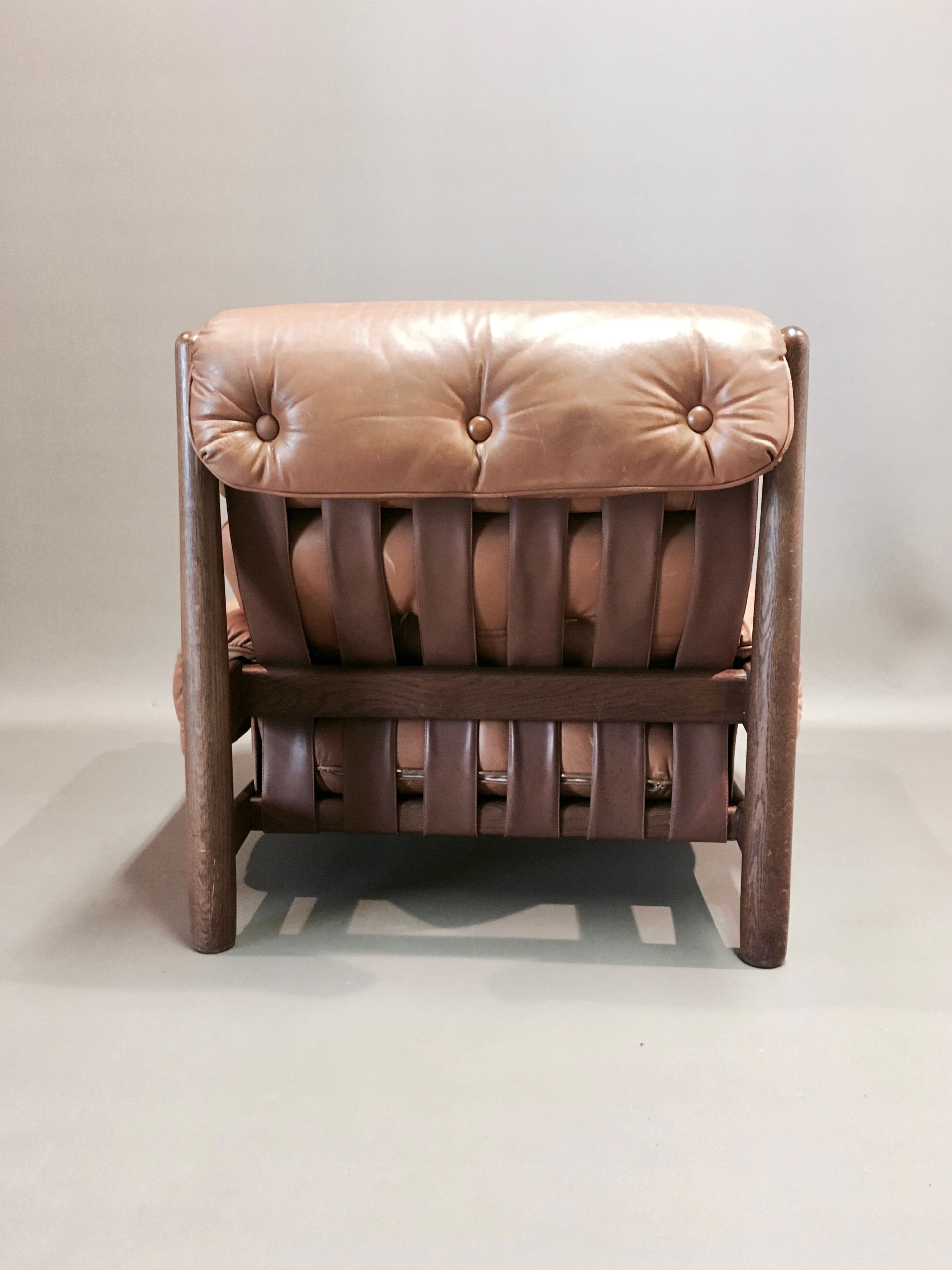 Leather armchair and oak, design 1950s