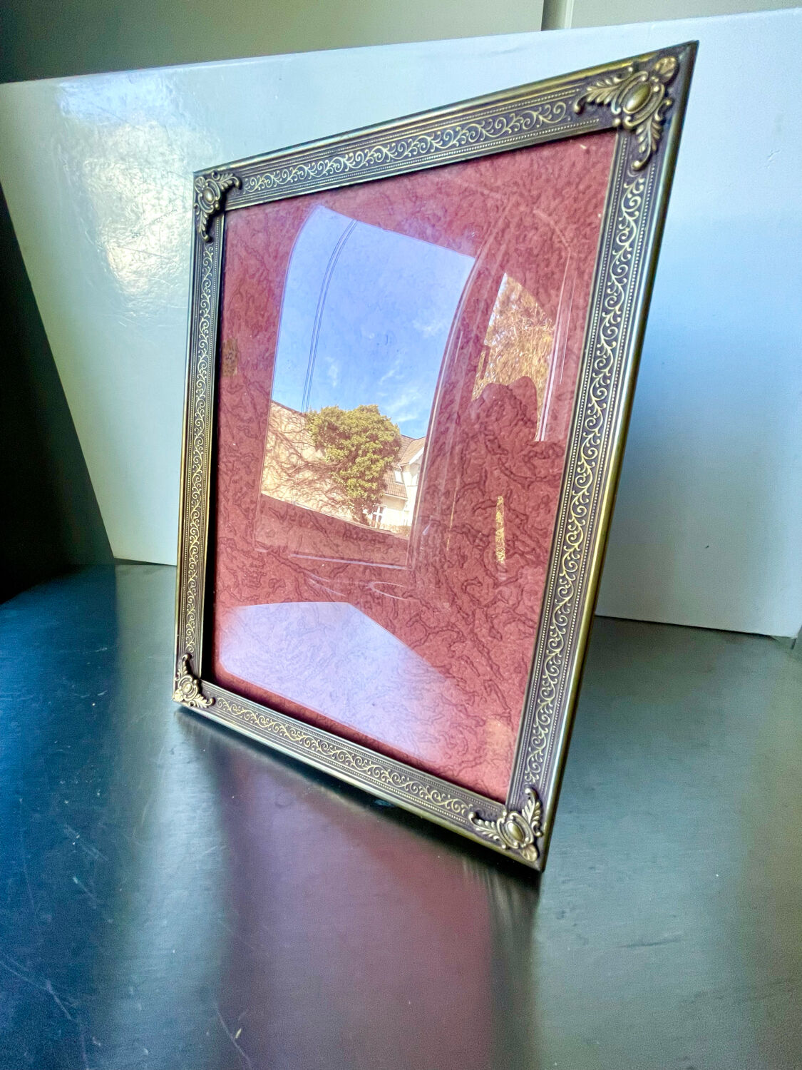 Metal frame in gold colored brass