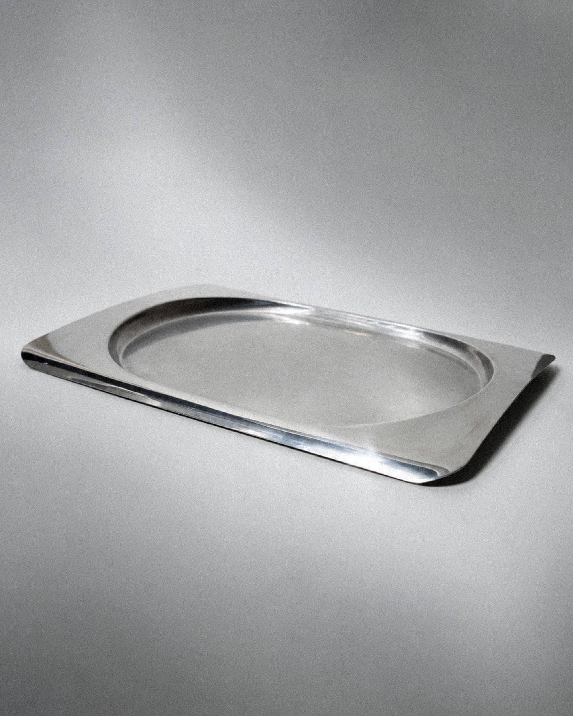 1990s vintage stainless steel platter, rectangular with an oval indentation, minimalist modern design.