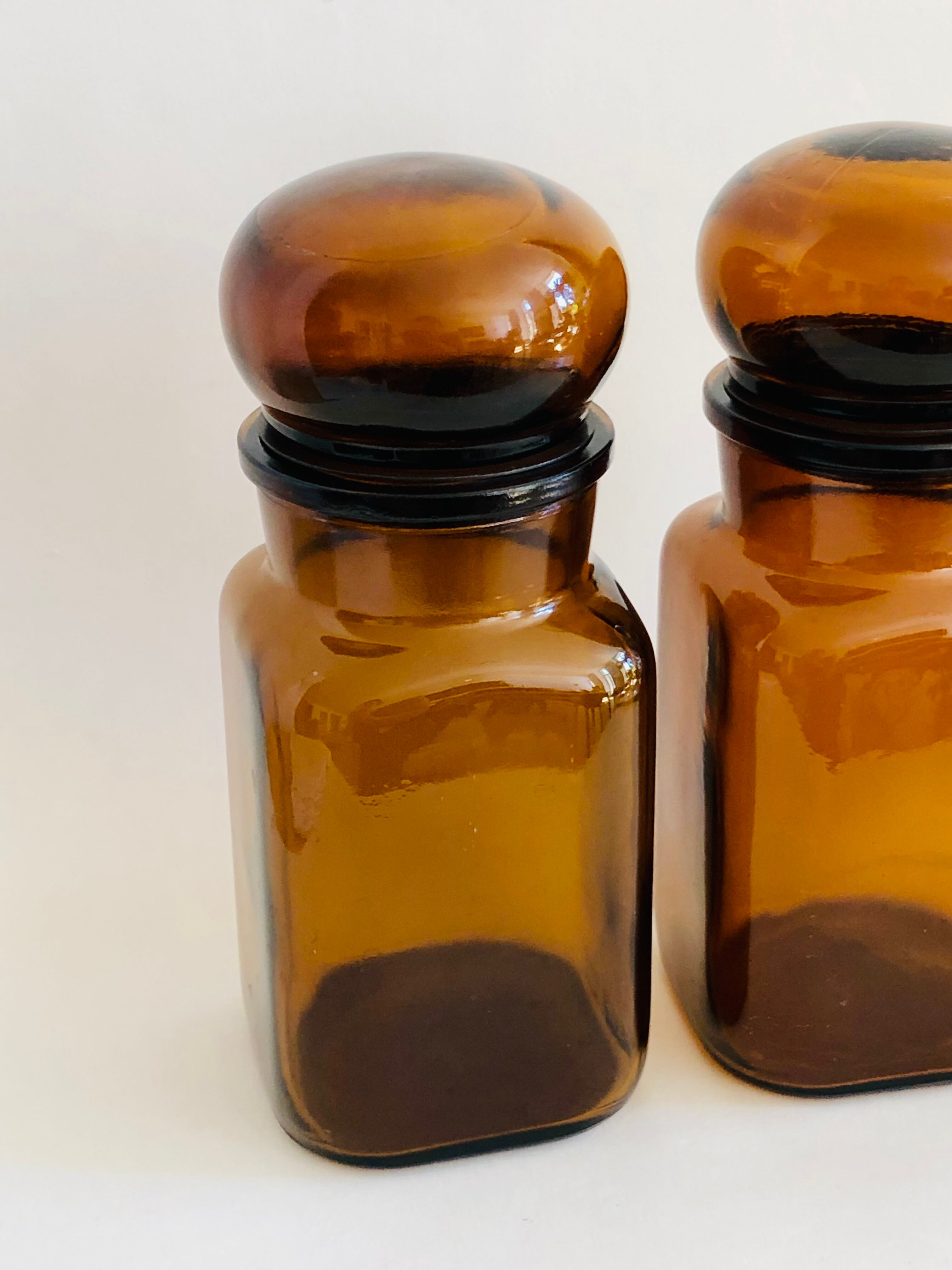 Pair of vintage amber glass jars