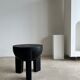 Black mango wood tripod side table with a semi-spherical top, height: 45 cm, diameter: 44 cm.