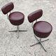 Set of 4 Mid Century Modern swivel chairs in tubular steel and leather.