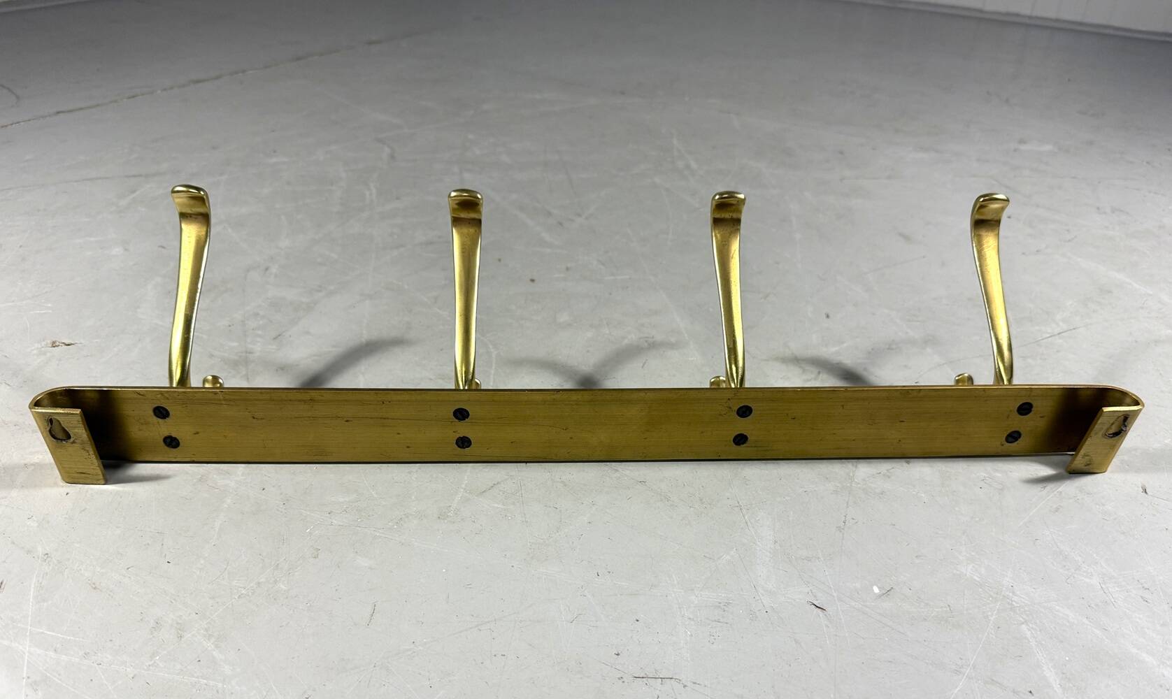 Gold coloured aluminium wall coat rack 1960’s
