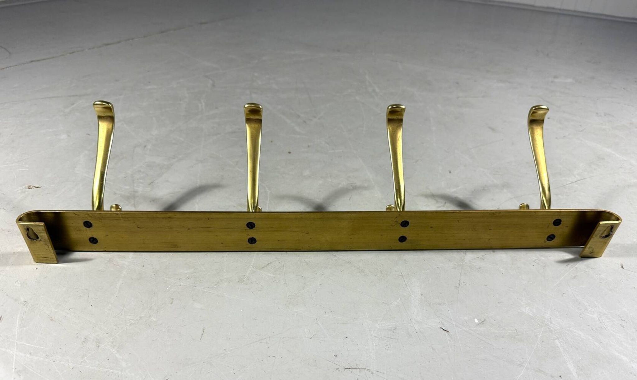 Gold coloured aluminium wall coat rack 1960’s